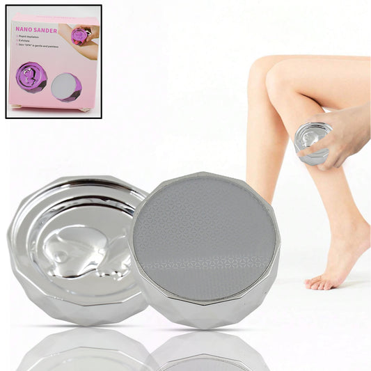 Silver portable skin hair remover device held against leg for gentle exfoliation and hair removal