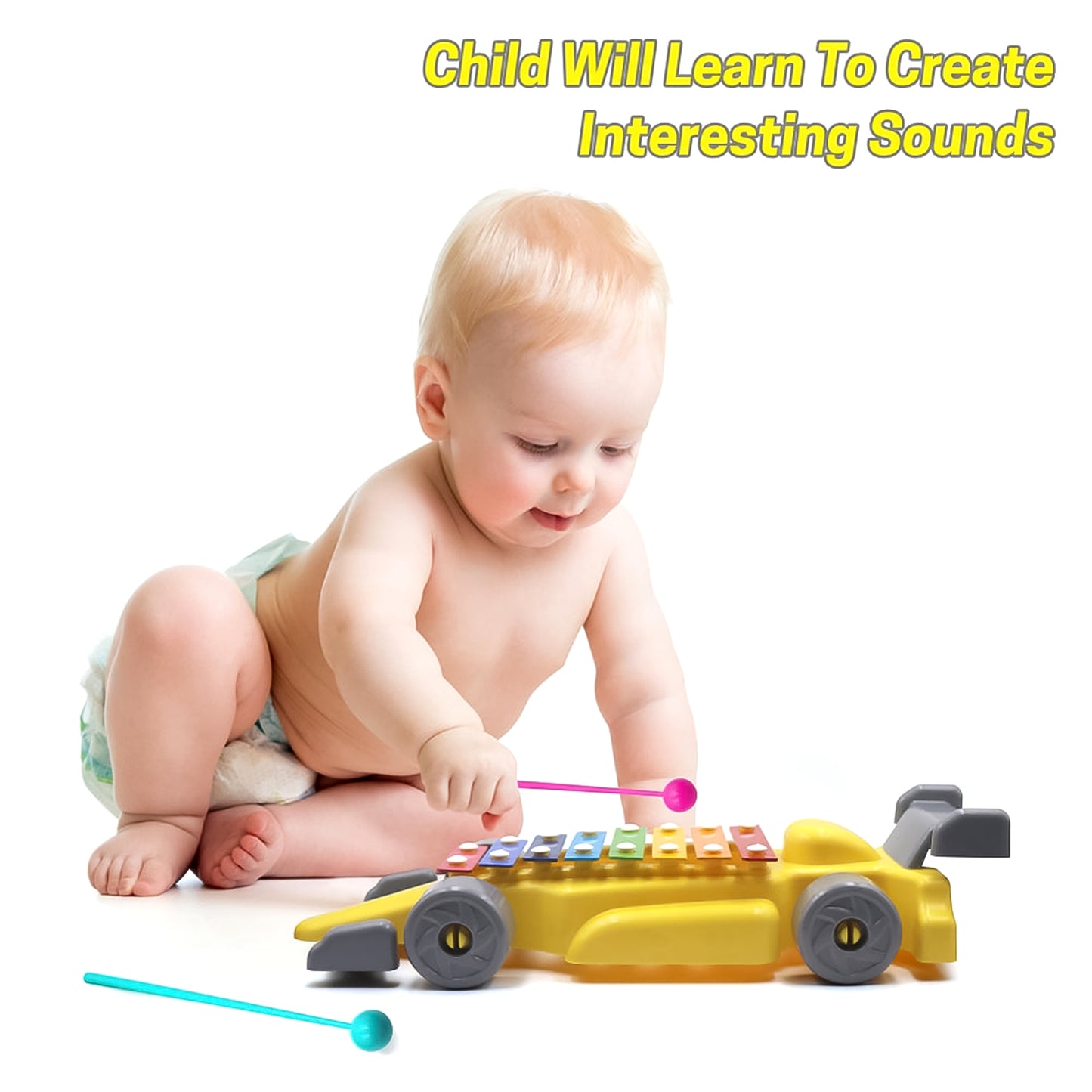 Baby playing with musical car xylophone toy in yellow on wheels with two mallets for early music learning