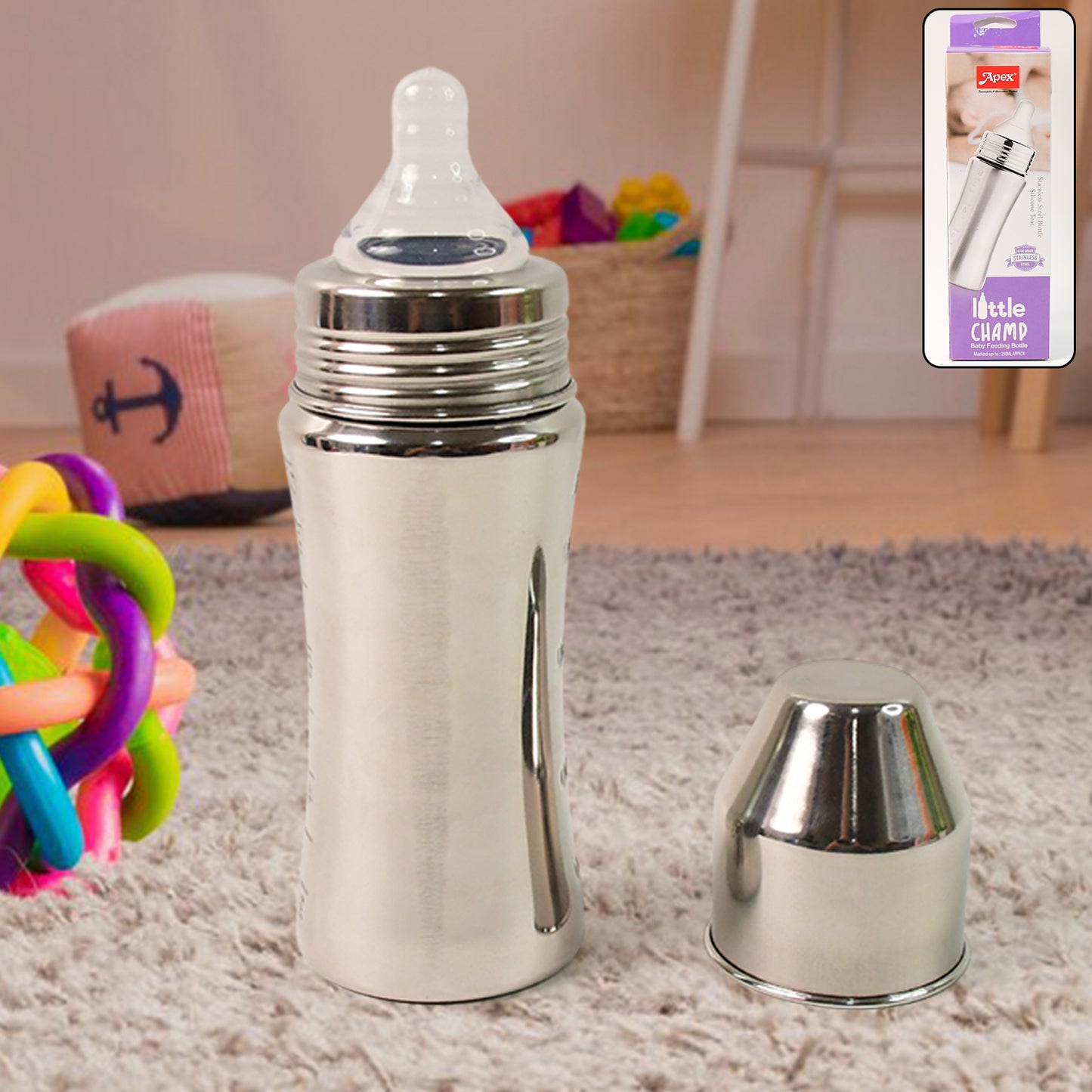 stainless steel baby feeding bottle with silicone nipple and removable travel cap on nursery rug