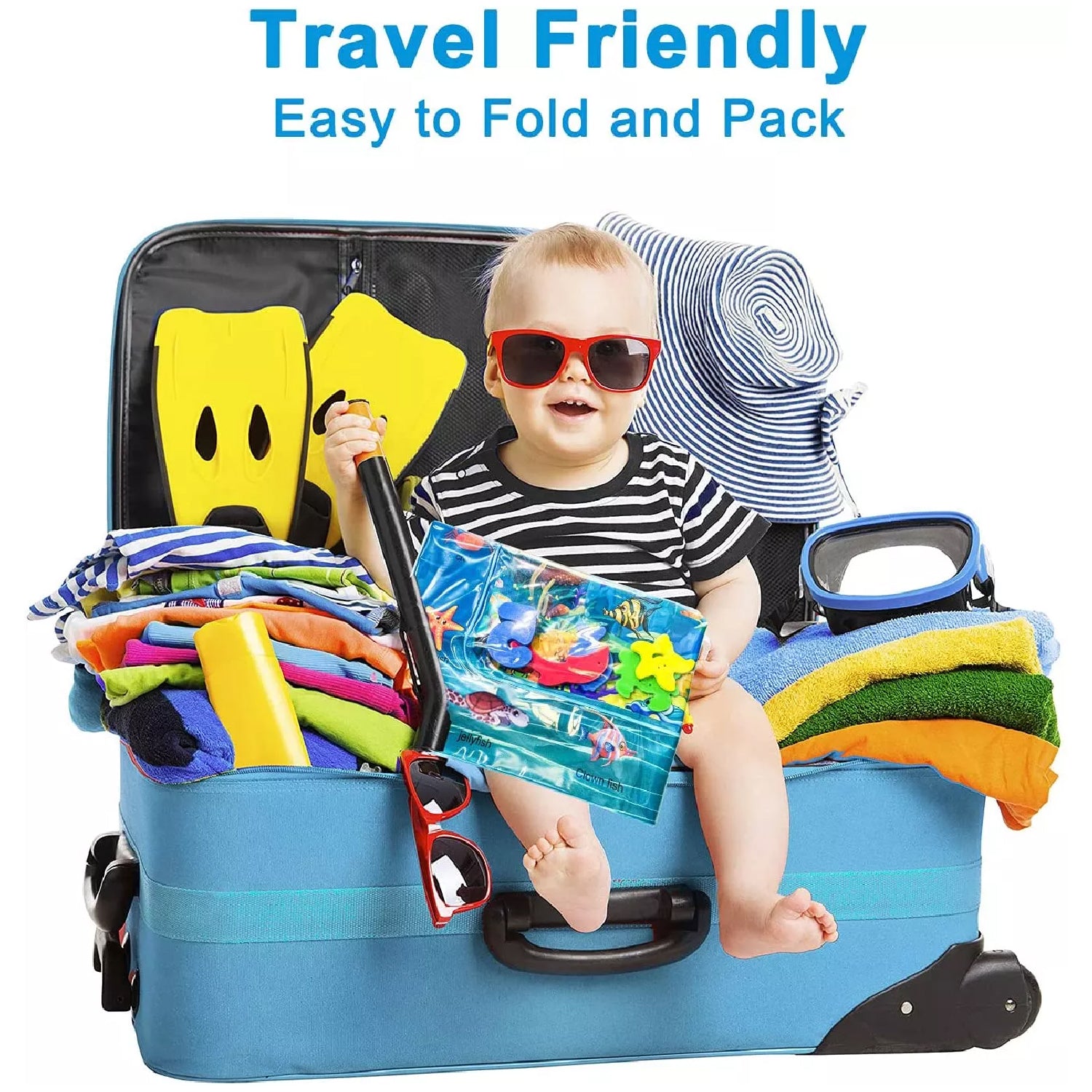 baby water play mat with toddler in sunglasses sitting inside a packed travel suitcase