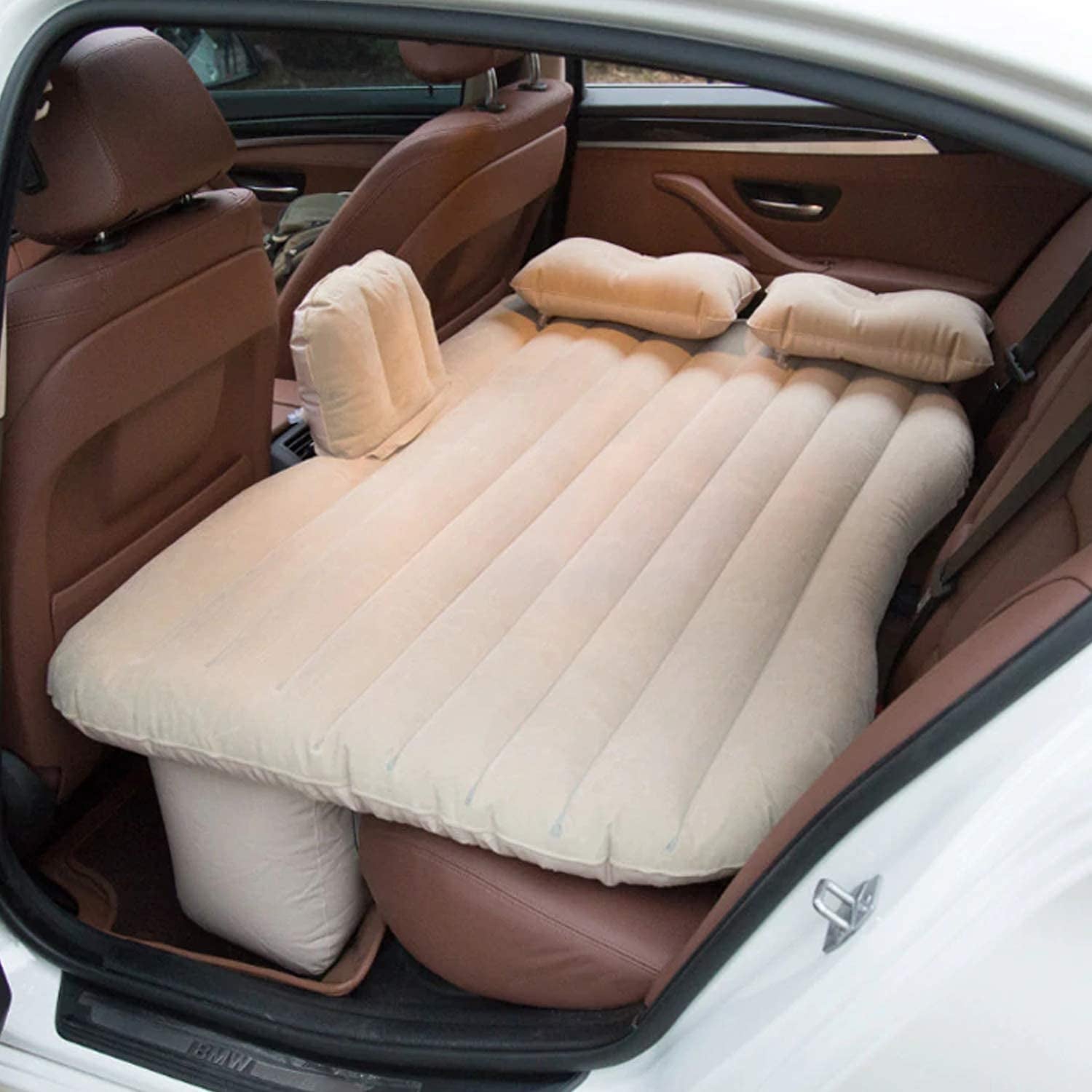 beige portable car air mattress for back seat with pillows and inflatable support pillars