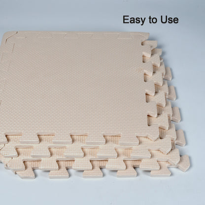 beige interlocking foam tiles stacked showing textured edges soft puzzle mats for babies crawling