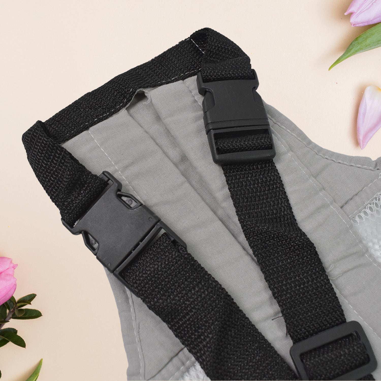 baby holder carrier for newborns gray fabric panel with black adjustable straps and plastic buckles