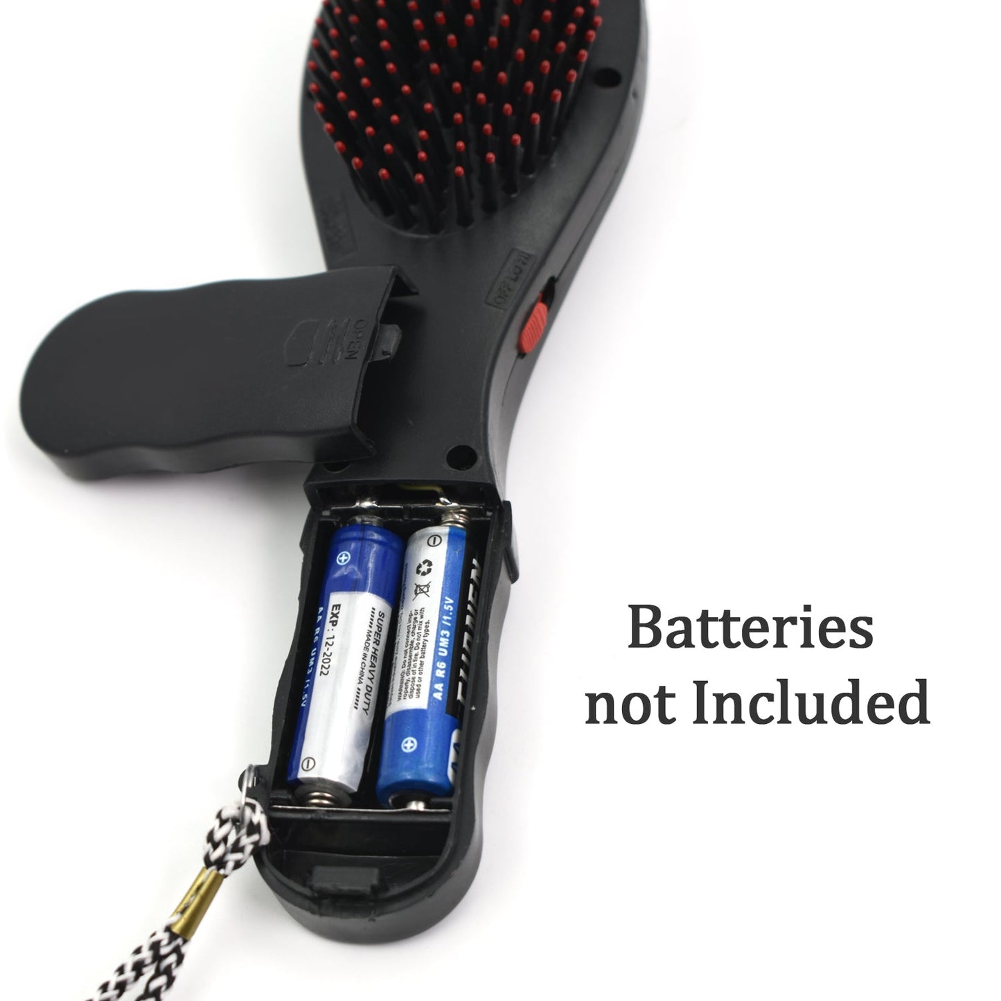black paddle hair brush with massage function showing open battery compartment and red tipped bristles