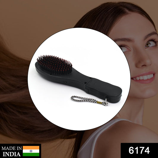 black paddle hair brush with massage function red tipped bristles and wrist strap