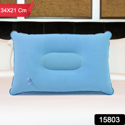 light blue compact inflatable pillow for camping 34 by 21 cm with center head cradle and air valve