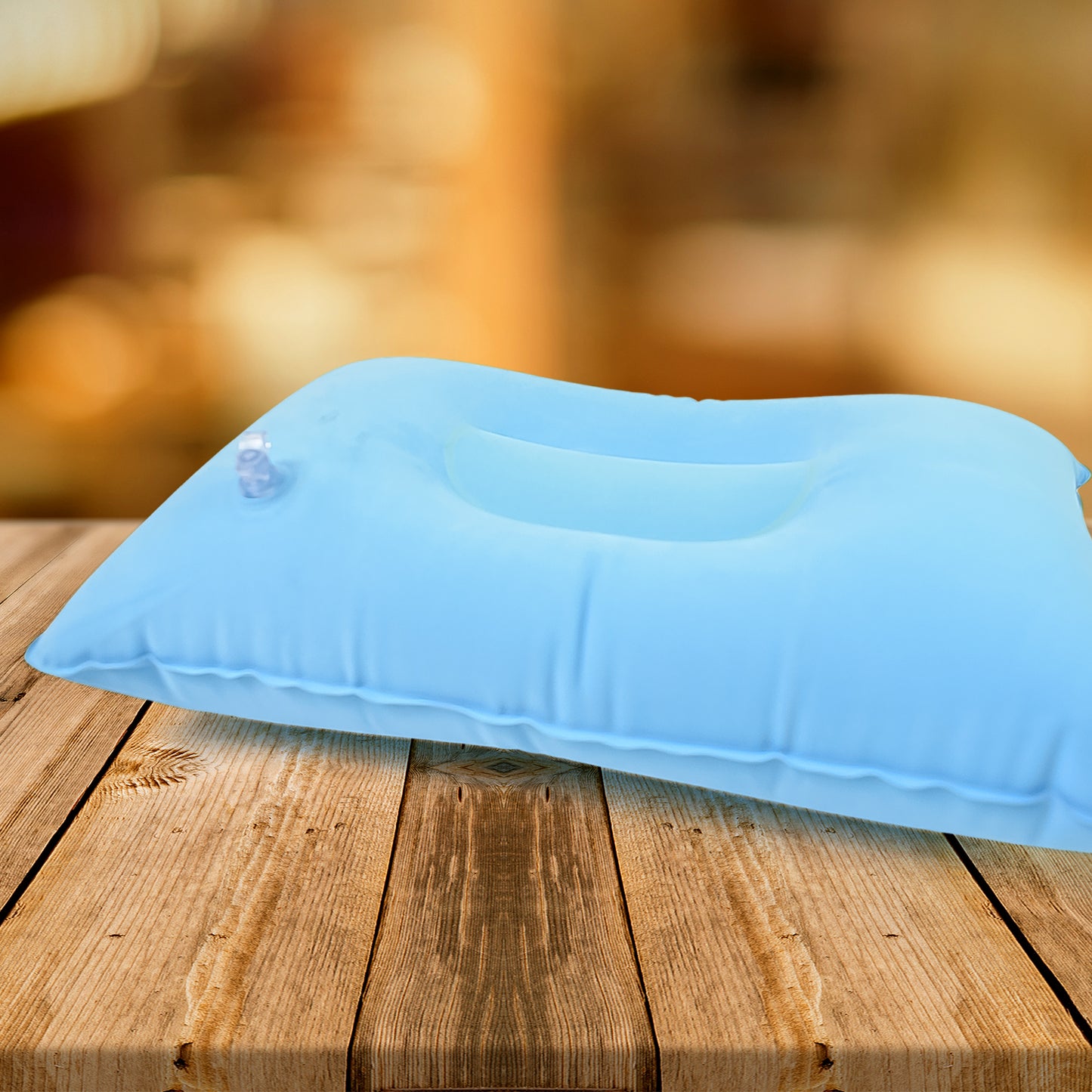 blue compact inflatable pillow for camping with valve and ergonomic head support for outdoor sleepers