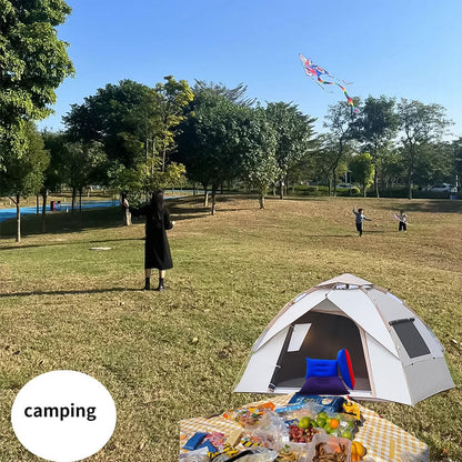 compact inflatable pillow for camping in blue inside tent at a picnic in park with kite flying