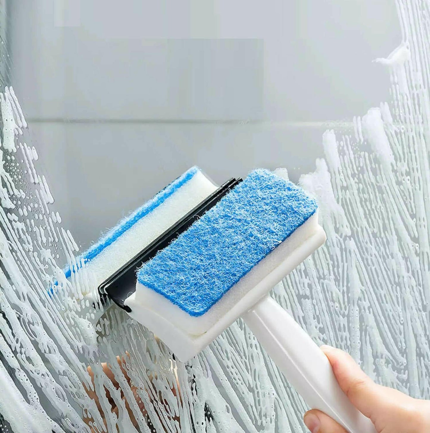 double-sided bathroom window wiper with blue scrub pads and squeegee cleaning soapy shower glass