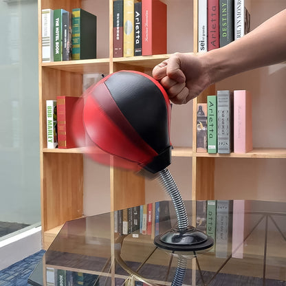 home office boxing ball kit red and black reflex punching ball on spring suction base on glass desk