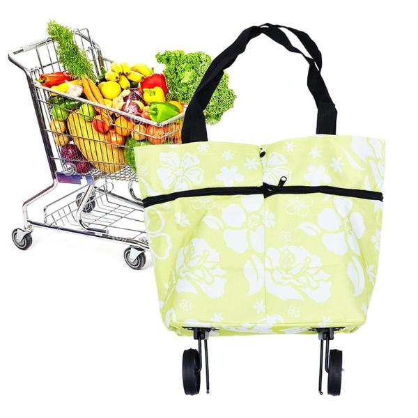 floral foldable travel luggage trolley bag with wheels and black handles and groceries