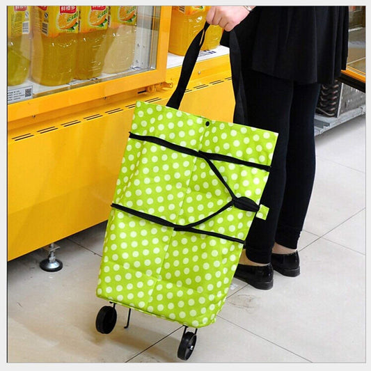 green polka dot travel luggage trolley bag with handle and wheels used for shopping or markets