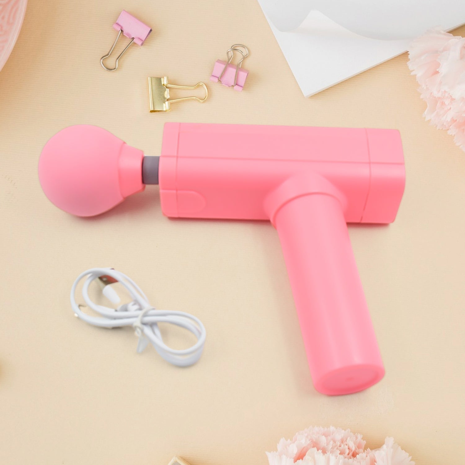 pink handheld massage gun with round attachment and USB cable powerful muscle massager for pain relief