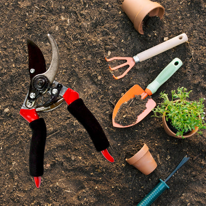 red black pruning shears with trowel hand rake and pots on soil best garden shears for home use