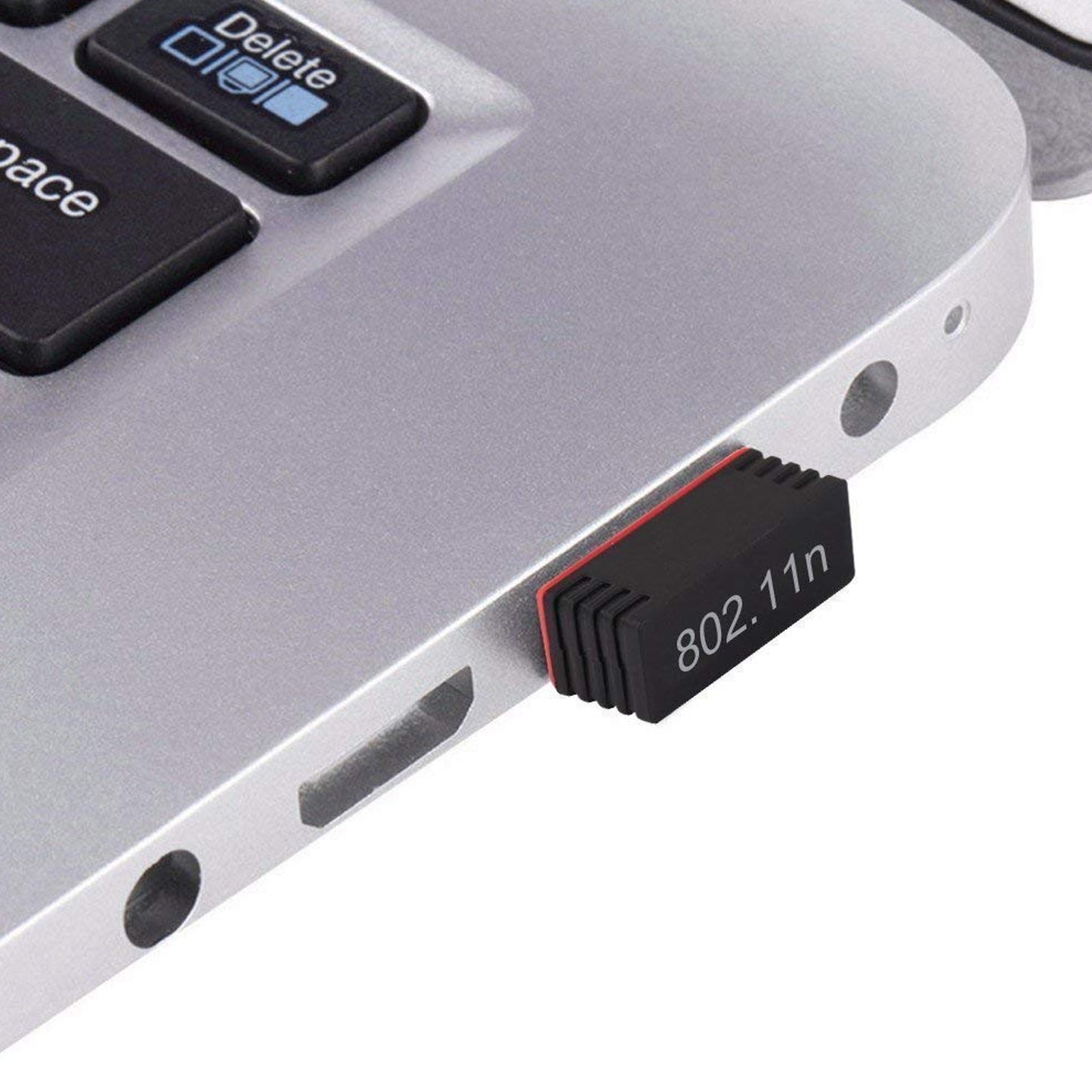 mini wi-fi adapter for laptop plugged into silver laptop USB port black compact dongle 802.11n