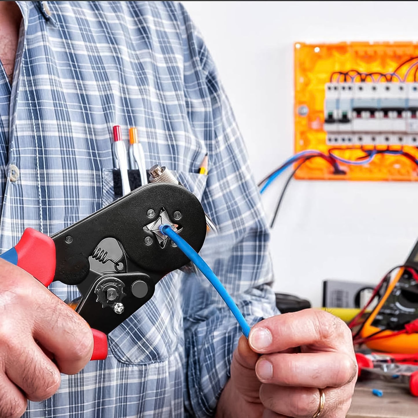 Electrician using crimper to attach blue wire ferrule to cable best wire end ferrules for electricians