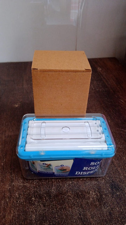 clear rectangular multi-purpose soap dispenser case with blue lid and refill rolls beside cardboard box