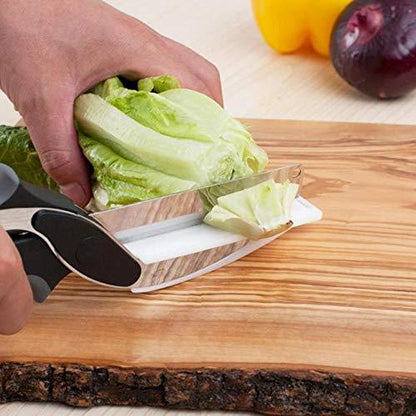 Wukusy stainless steel food chopper tool slicing lettuce on wooden cutting board with ergonomic handle