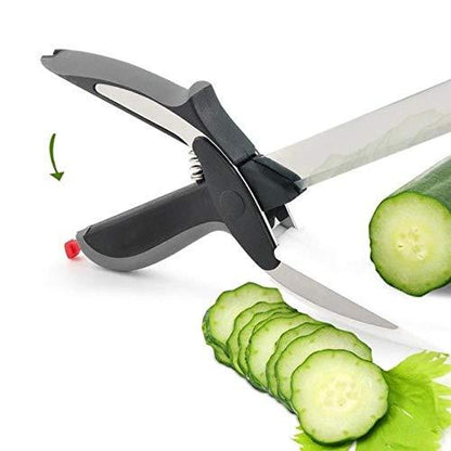 stainless steel food chopper tool clamped to chef knife slicing cucumber with ergonomic safety handle