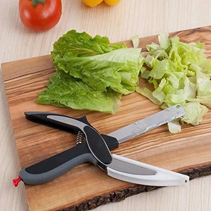 stainless steel food chopper tool on wooden board chopping lettuce with ergonomic non slip handles