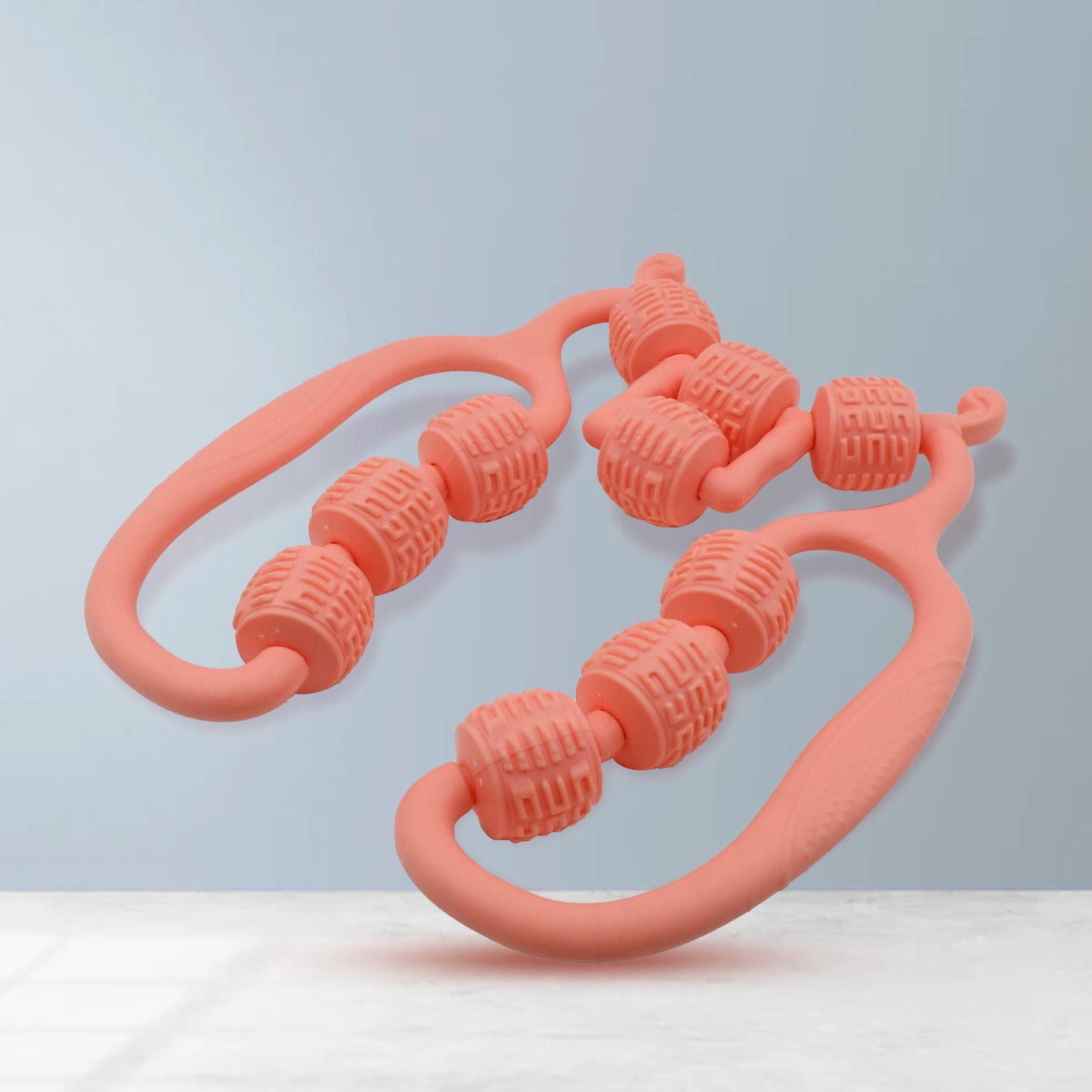 coral dual handle handheld massage roller with textured beads massage roller ring for home use to relieve muscle tension