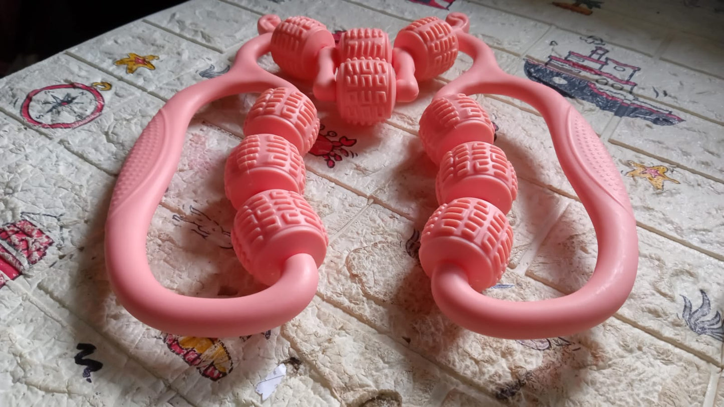 pink handheld massage roller ring for home use with dual handles and textured rotating massage beads for body
