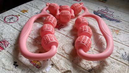 pink handheld massage roller ring for home use with dual handles and textured rotating massage beads for body