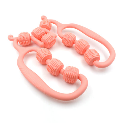 pink handheld massage roller ring for home use with textured rotating beads and ergonomic handles for muscle relief