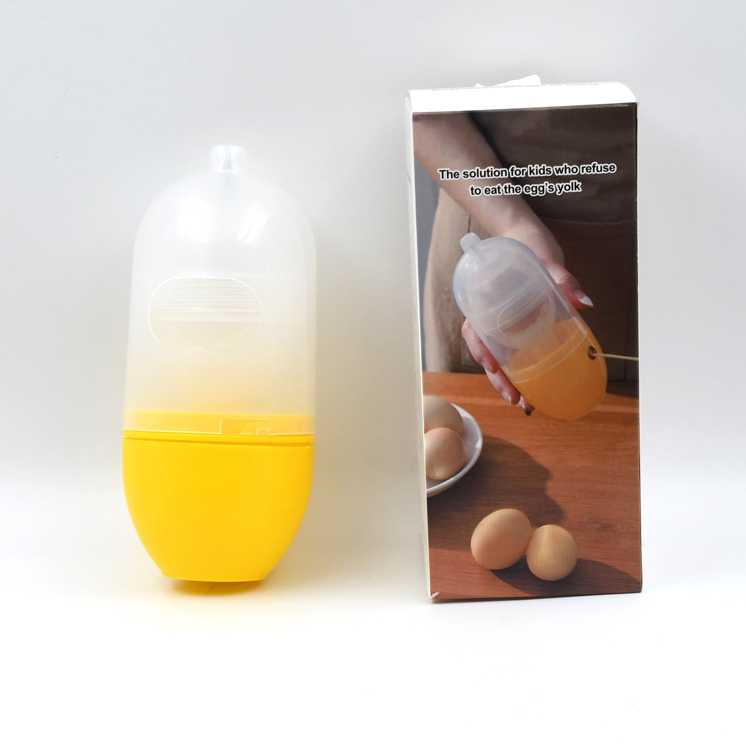 household egg puller gadget yellow translucent plastic yolk extractor with packaging and eggs