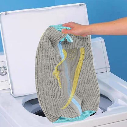 machine washable shoe bag durable gray ribbed wash bag with mesh panels holding a yellow sneaker over a top loading washer