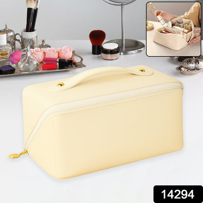 premium cream makeup bag with top handle and gold zipper on vanity with cosmetics