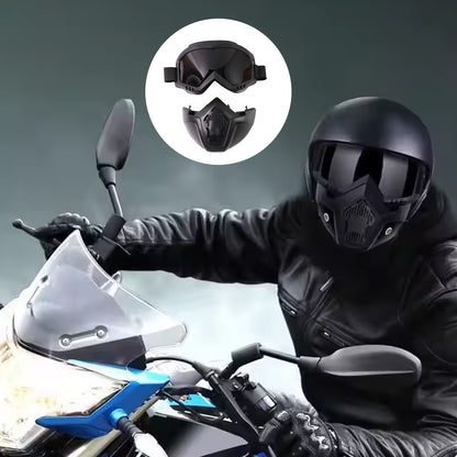 black motorcycle goggles with mask set shown on rider wearing black helmet on blue bike