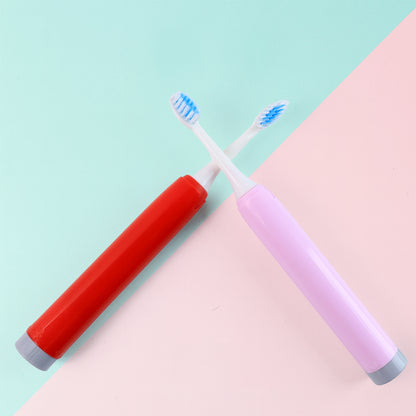 two battery toothbrushes red and pink crossed on pastel background best battery toothbrush for adults