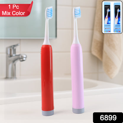 Red and pink battery toothbrushes on bathroom sink best battery toothbrush for adults