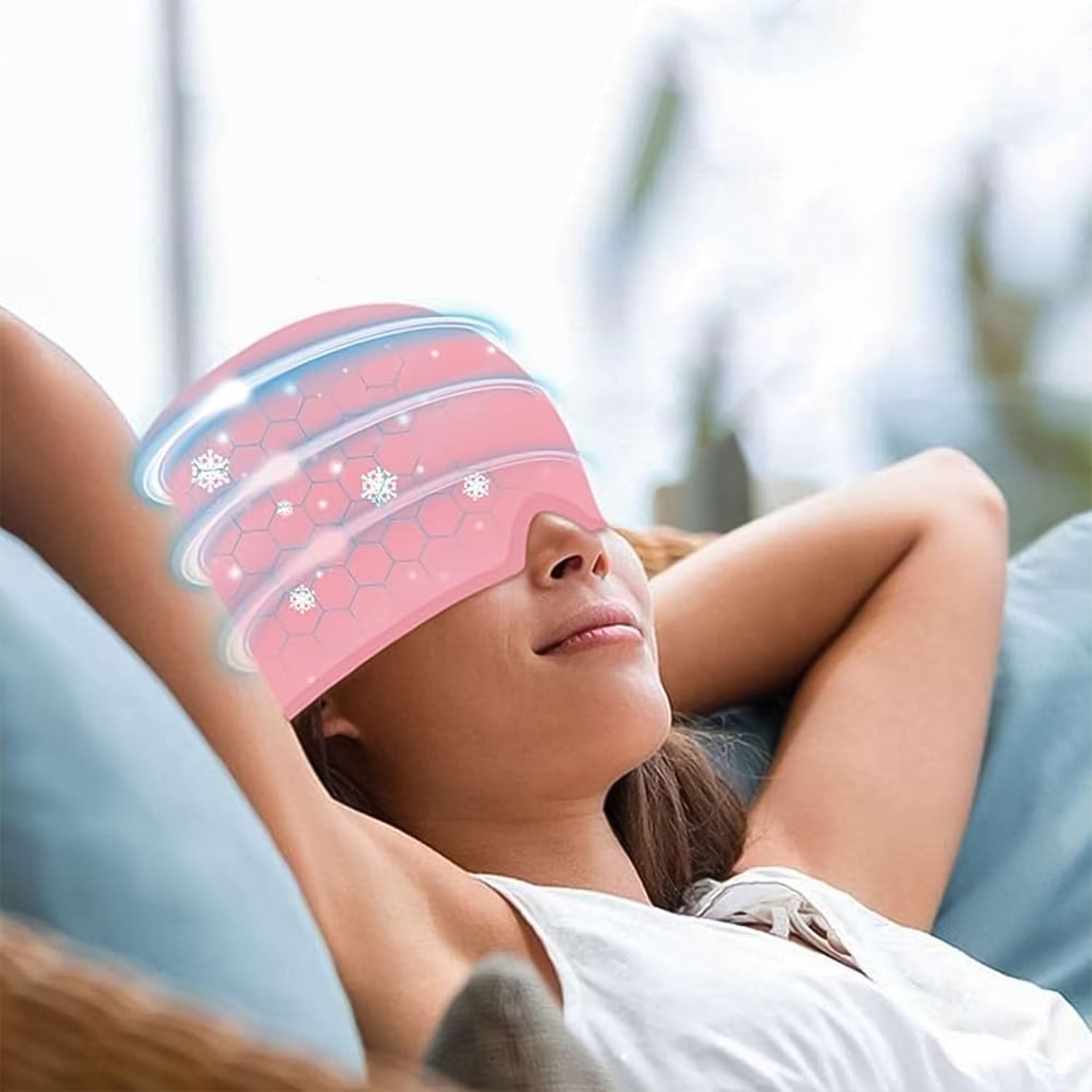 Woman reclining with a pink illustrated cooling eye pad overlay, product listing for black headache relief wrap