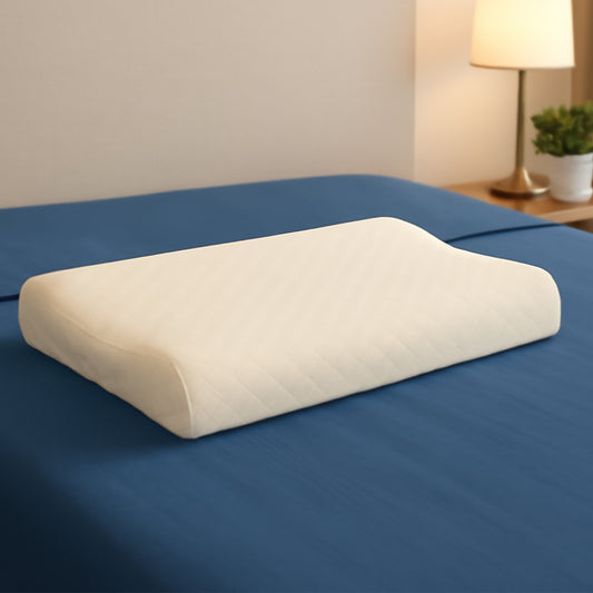premium cervical pillow for neck pain white contoured memory foam pillow on blue bed for ergonomic neck support