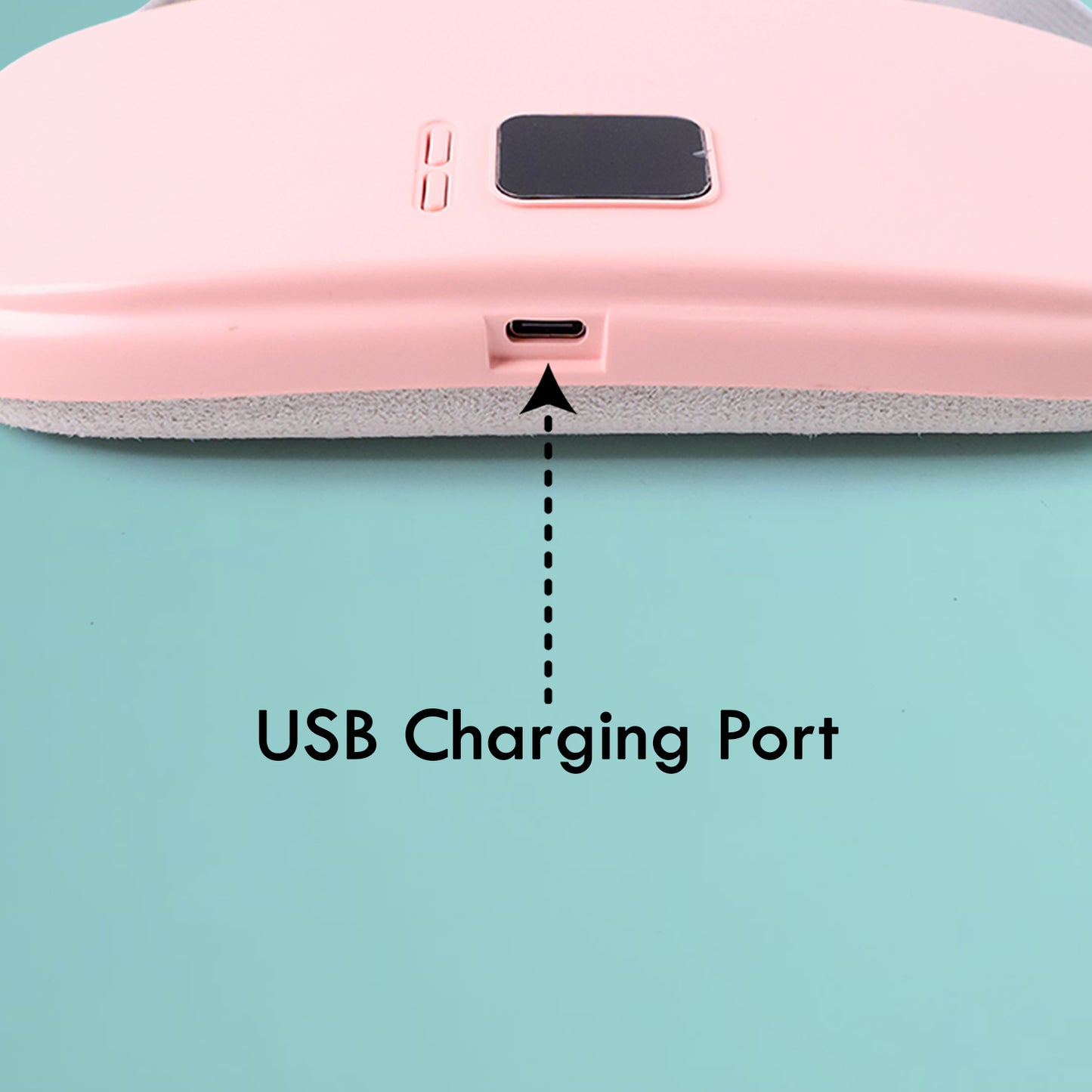 Pink pain relief heating belt for women showing USB charging port and control buttons close up