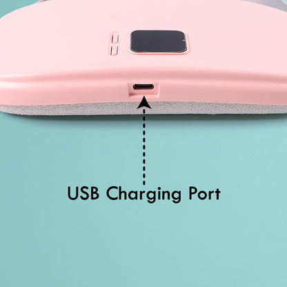 Pink pain relief heating belt for women showing USB charging port and control buttons close up