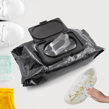 black flip top pack of shoe cleaning wipes with hand wiping gold splattered white sneaker