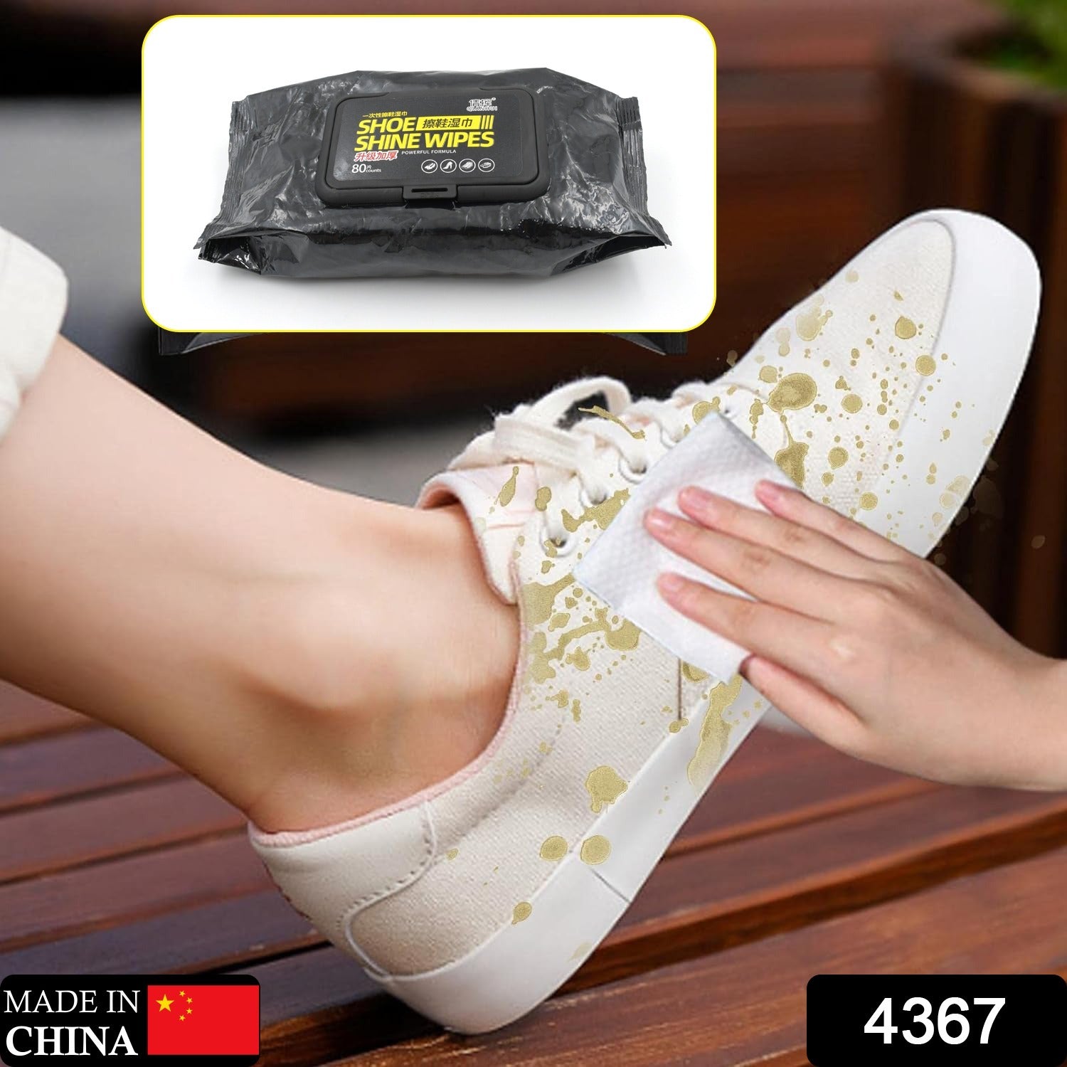 shoe cleaning wipes packet and hand cleaning white canvas sneaker with paint stains outdoors