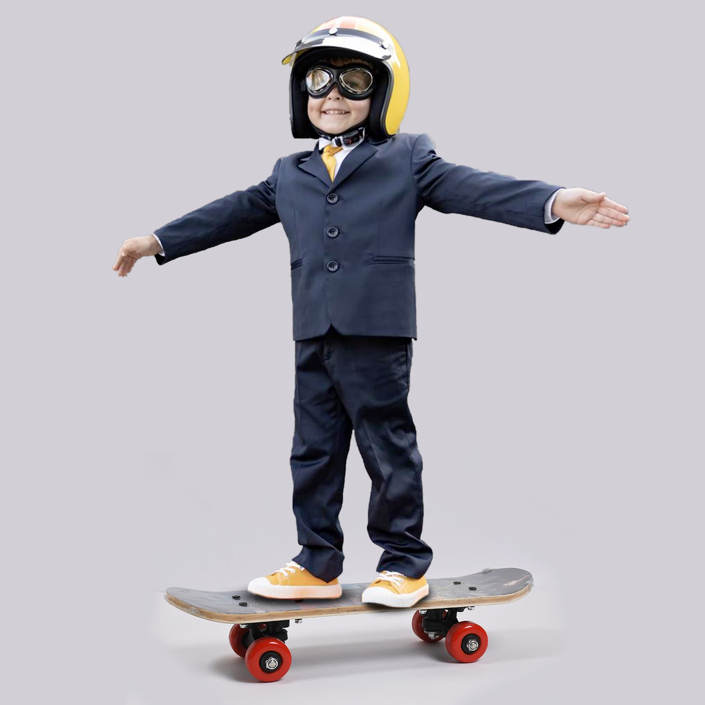 toy image boy in suit and helmet balancing on a wood skateboard for beginners with red wheels