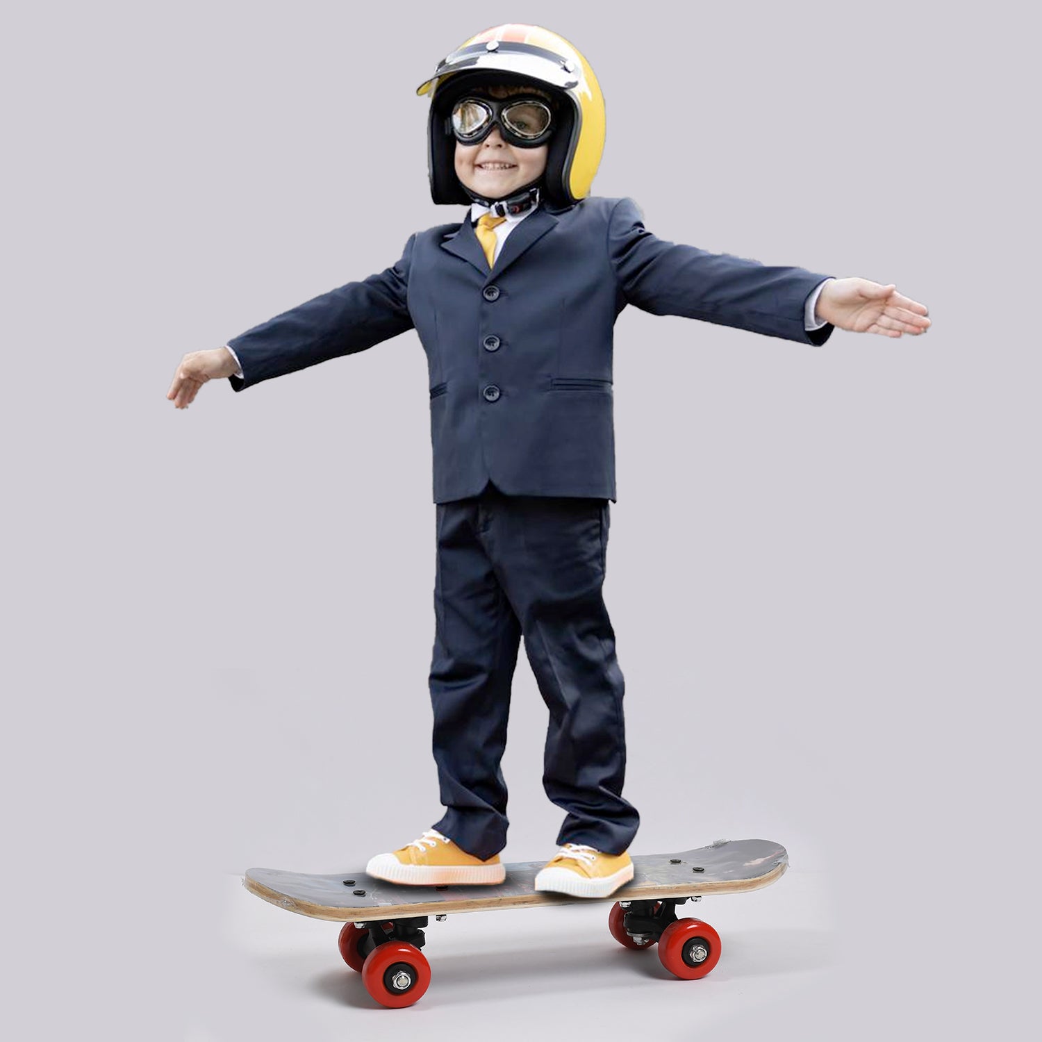 toy image boy in suit and helmet balancing on a wood skateboard for beginners with red wheels