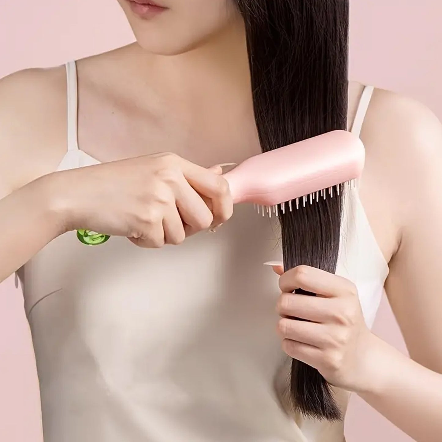scalable rotating hair styling tool pink brush used on long straight hair for smoothing