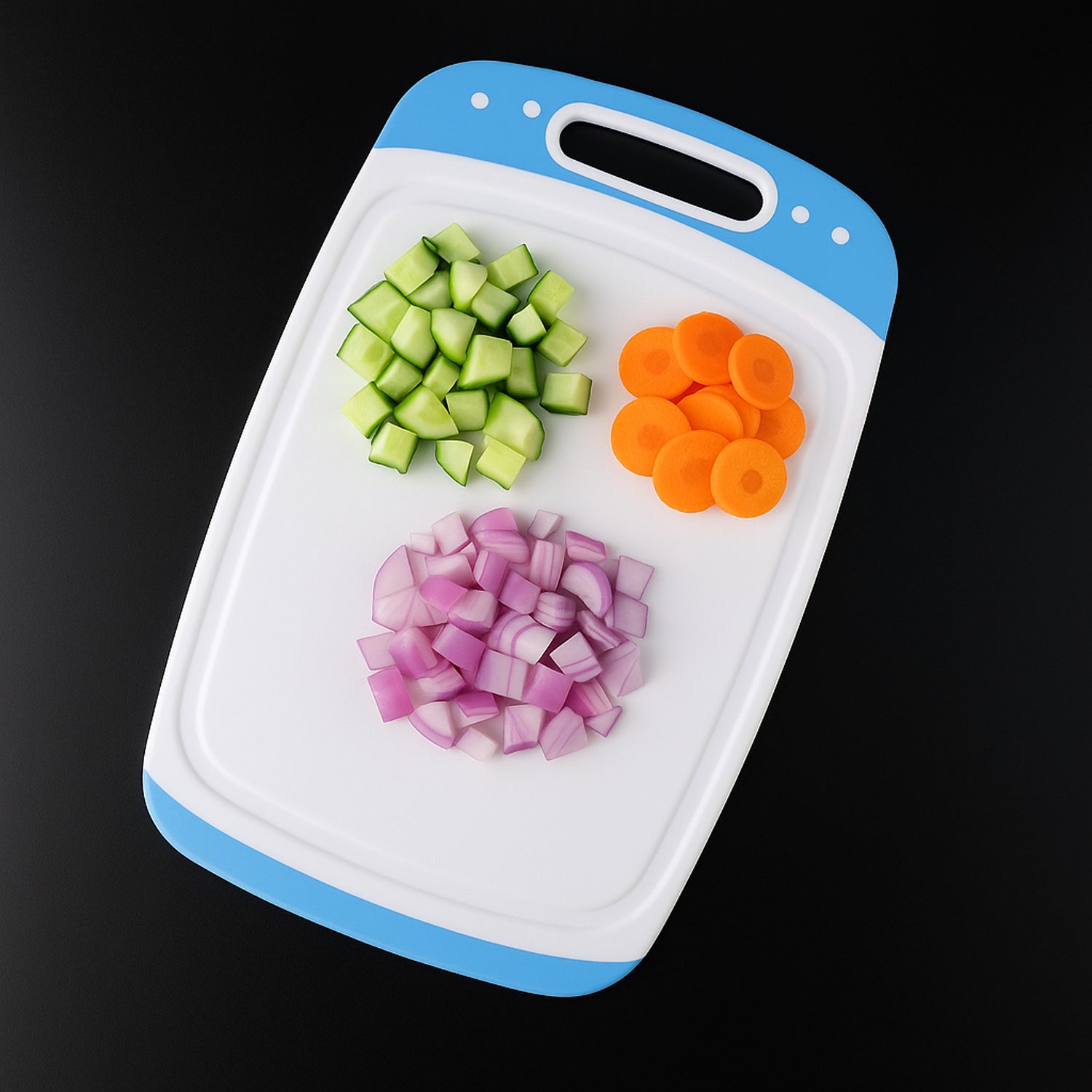 white and blue plastic cutting board with handle and chopped cucumber carrot onion best chopping board for home use