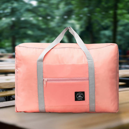 pink large capacity luggage bag for travel with front zip pocket and sturdy gray handles