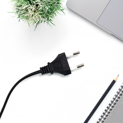 high power glue gun for DIY projects black two pin power cord on white desk with laptop and notebook