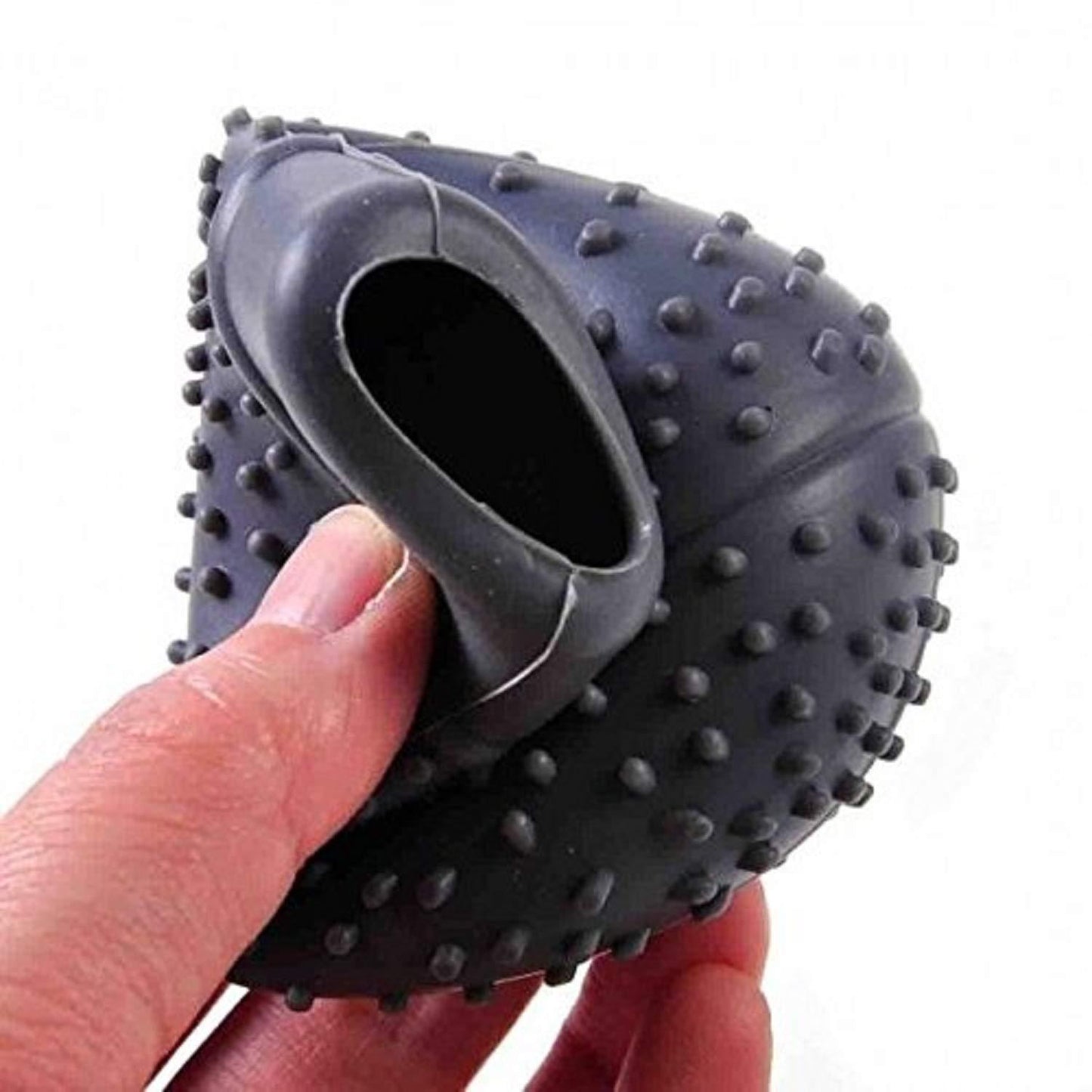 silicone car gear shift knob protector with raised grip studs being stretched by hand