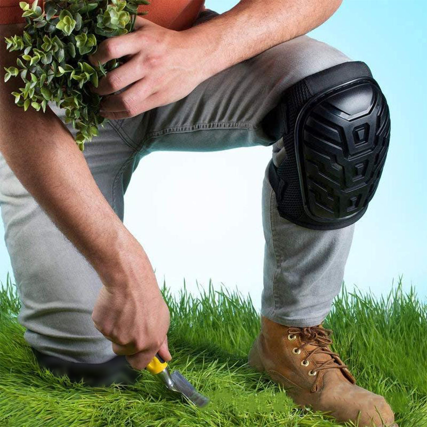 shock-resistant knee pads for construction shown on a gardener kneeling in grass using a trowel